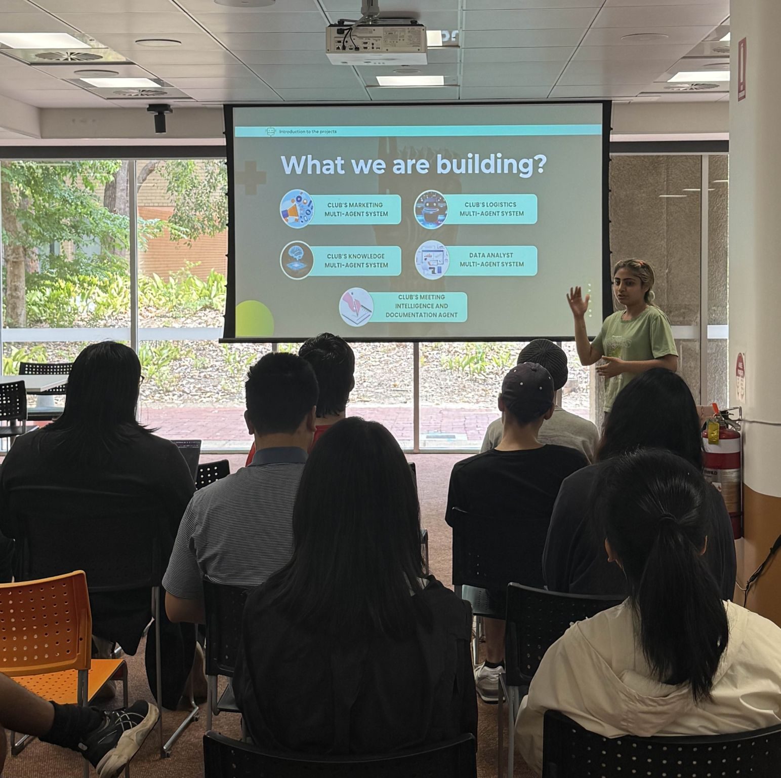 A team demoing their agentic system at the Summer Projects showcase